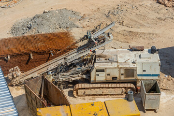 Horizontal directional drilling technology closeup. Drilling machine work process. Trenchless laying of communications, pipes and water pipes.