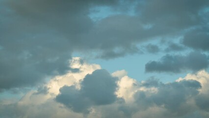 Poster - Dark blue and white clouds in evening sky. Clouds floating through sky, timelapse video