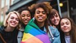 © Space_Background - close up Group of young activist for lgbt rights with rainbow flag, lesbian, rainbow, freedom, diversity, bisexual, gay, celebration, community