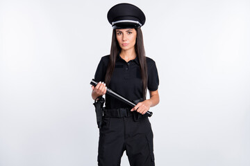 Wall Mural - Photo of suspicious serious young police lady wear black uniform cap holding flashlight isolated white color background