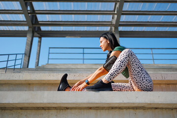 Wall Mural - Active Young Woman Practicing Yoga Outdoors