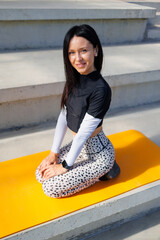 Wall Mural - Stadium Serenity: Yoga Postures by a Young Woman