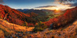 Autumn mountain panorama with red autum trees.
