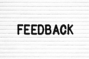 Poster - Black color letter in word feedback on white felt board background