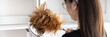 © Puwasit Inyavileart - Housewife holding a dusting brush to clean things Pillows, rugs and other things in the living room, Big cleaning, Daily routine, Clean up on weekends.