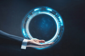 Business man holding virtual interface circle on dark background with copy space.Businessman hand holding blue light cirkle.Digital transformation conceptual for next generation technology.