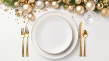  A White Plate Topped With A Knife And Fork Next To A White Plate Covered In Gold Ornaments And A White Plate With A Gold Fork And Knife On A White Background.
