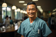 © Kitta Studio - Portrait of smiling doctor standing in corridor of hospital with colleagues in background