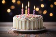 White vanilla birthday cake with sprinkles and candles