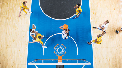 Wall Mural - Top Down View of Talented Basketball Player Scoring Striking Slam Dunk Goal. Shot of Two International Teams Playing Basketball Match at a Professional Arena, Competing In Championship.