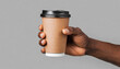 mockup of male hand holding a coffee paper cup isolated on light grey background