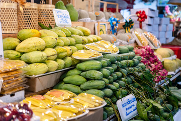 Wall Mural - Bangkok, Thailand - September 12, 2023: Thai street food, fresh fruits, drink, ice cream and smoothies, with varieties of the tasty food, selling along the road side at Chatuchak weekend market. 