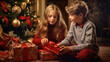 Sister and brother in sitting room unwrapping christmas gifts