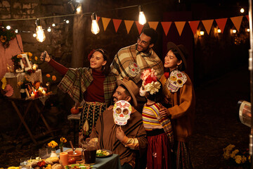 Wall Mural - Group of people in traditional clothes making selfie portrait together during holiday