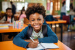 © Adin - Portrait happy african american boy curly hair working homework. Concept education in school offline