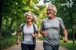 © Moritz - Elderly old couple jogging in a park: Celebrating health and fitness in later life
