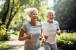 © Moritz - Elderly old couple jogging in a park: Celebrating health and fitness in later life