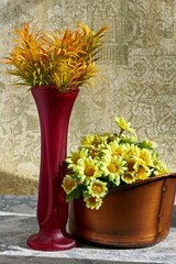 Wall Mural - Still life photography with yellow flowers in a copper vase