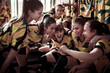 © Davor - Youth Soccer Team Sharing a Laugh in the Locker Room
