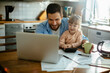 © Geber86 - Father and Daughter Enjoying Time Together with laptop at Home