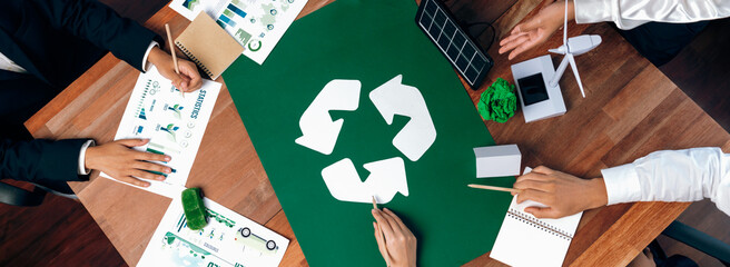 Wall Mural - Top view business people planning and discussing on recycle reduce reuse policy symbol in office meeting room. Green business company with eco-friendly waste management regulation concept.Trailblazing