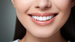 © DYOLF - Young woman with perfect healthy pearly white teeth smile.