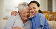 © Azeemud/peopleimages.com - Happy woman, nurse and hug in elderly care for support, trust or love on living room sofa at old age home. Face of female person, doctor or medical caregiver hugging senior patient in relax at house
