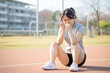 Young woman has knee pain while exercising and running. Healthcare and sport concept.