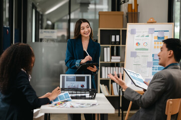 diverse team of professionals engaged in a website graphic design board meeting, sharing opinions on UX and UI design elements. Asian man, African American people, black, afro, caucasian female