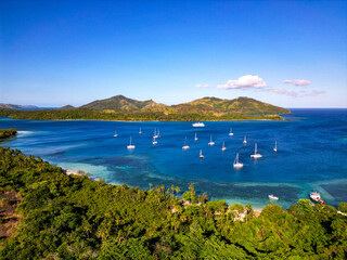 Wall Mural - boats moored of shore of fijian tropical island. nanuya island, yasawa islands.