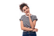 © Ivan Traimak - young caucasian woman with curly hair dressed in a striped summer t-shirt is brainstorming