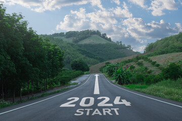 Wall Mural - Happy new year 2024,2024 symbolizes the start of the new year. The letter start new year 2024 on the road in the nature route roadway have tree environment ecology or greenery wallpaper concept.