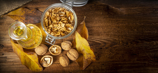 Wall Mural - walnuts oil on a table