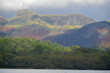 The small lake of Elterwater beneath the Langdale Pikes in the Lake District
