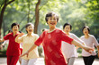 © colnihko - Chinese elderly women dancing on city park as a hobby and cultural phenomenom