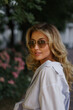 © Svetlana Sokolova - Beautiful blond woman  in stylish fashion casual outfit posing  on the street.  Warm sunset color.