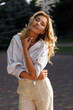 © Svetlana Sokolova - Beautiful blond woman  in stylish fashion casual outfit posing  on the street.  Warm sunset color.
