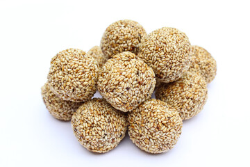 Indian sweet sesame laddu or til laddu on white background close-up view 