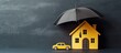 Insurance protects properties like cars and homes depicted as paper cutouts under a yellow umbrella on a blackboard background Copy space image Place for adding text or design