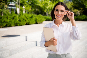 Sticker - Photo of gorgeous lovely woman dressed stylish shirt hold eyeglasses netbook spending break free time green park