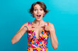 Photo of astonished lovely ecstatic woman dressed colorful clothes indicating at herself win lottery isolated on blue color background