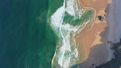 Sticker - Drone flying high above the shore with blue waves of amazing beauty and turquoise water