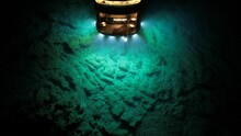 High-powered lamp illuminating a deep underwater exploration scene