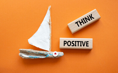 Wall Mural - Think Positive symbol. Concept word Think Positive on wooden blocks. Beautiful orange background. Business and Think Positive concept. Copy space