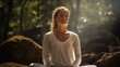 A young white woman meditating in forest, practicing mindfulness and focused breathing to improve her mental well-being.breathwork concept
