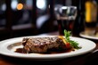 A delectable steak meal, with a savory sauce, cooked to perfection, adorned with rosemary, served on a plate.