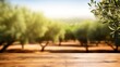 empty wooden table top for product display montages with blurred olive trees background