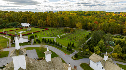 An Aerial View of a Large Gazebo in the Middle of a Vineyard, With Seating for a Weddings on an Autumn