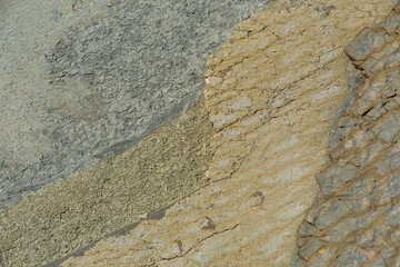 natural stone in the rocky mountains, the texture of slate and stone ore close-up.	
