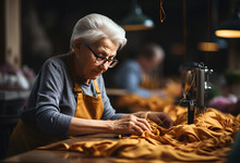 An Old Woman Sews In A Factory